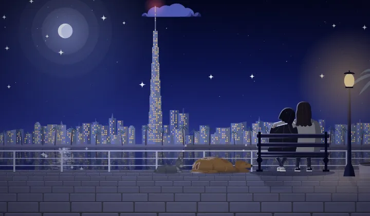 The Burj Khalifa lit up at night over Burj Lake